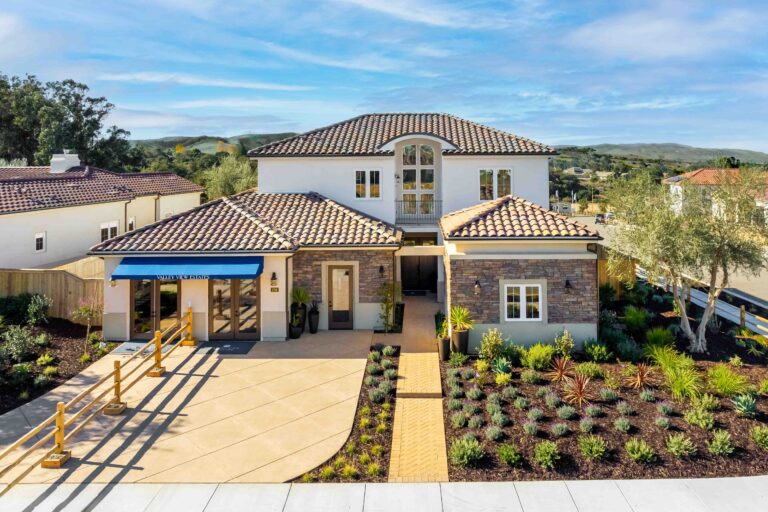 Luxurious suburban home with landscaped garden and tiled roof.
